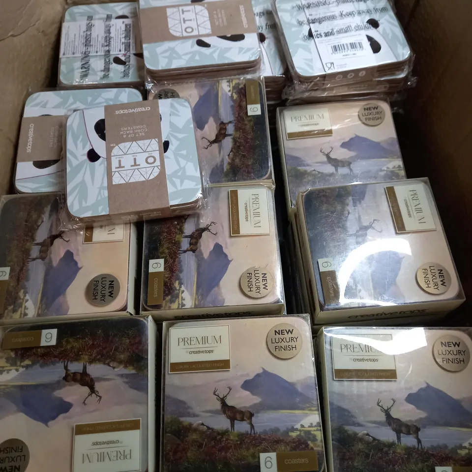 BOX OF APPROXIMATELY 80 PACKETS OF CREATIVE TOPS CORK BACKED COASTERS IN A STAG & PANDA DESIGN 