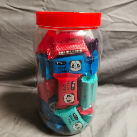 CLEAR PLASTIC CONTAINER OF APPROXIMATELY 20 ASSORTED PATCH PANDA CANDY CABLE DATA WIRES