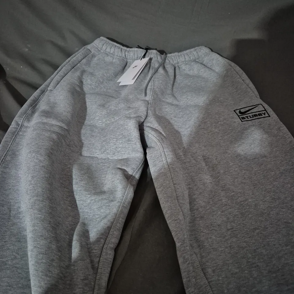 NIKE X STUSSY LIGHT GREY TRACKSUIT PANTS - MEDIUM