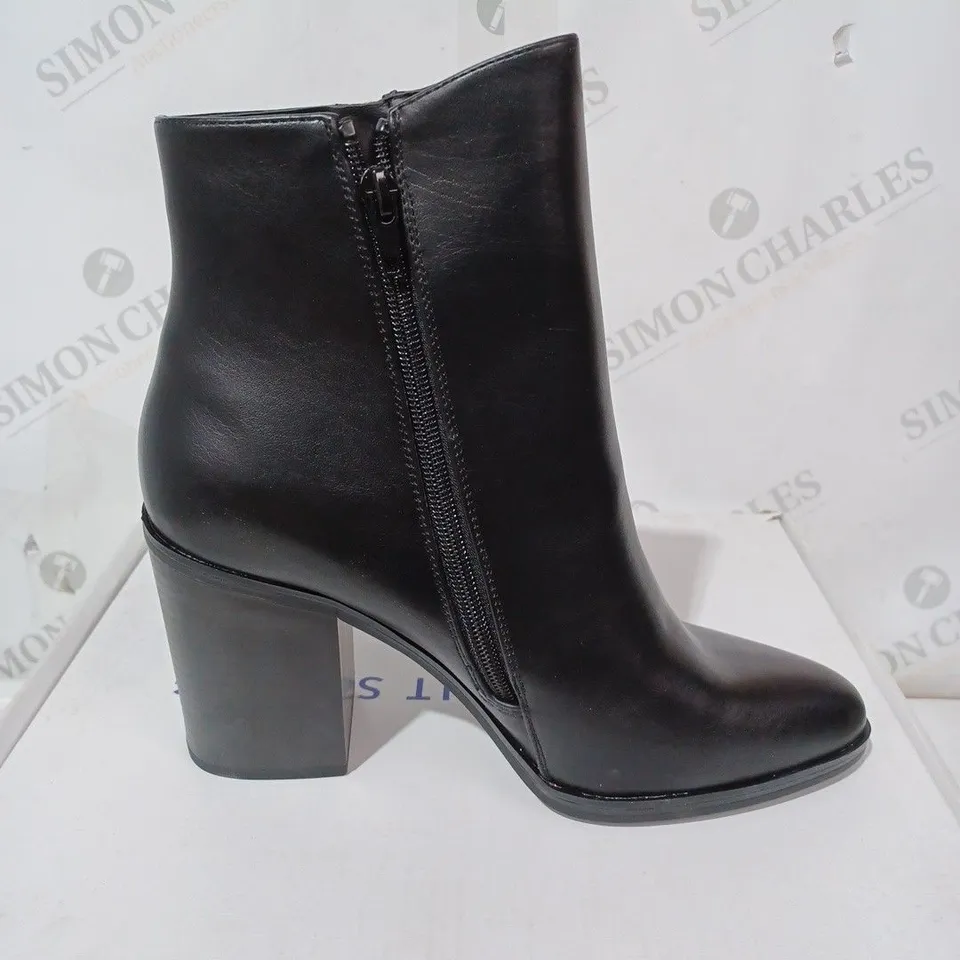 BOXED PAIR OF CALL IT SPRING EROECIA BLOCK HEEL ZIP-UP BOOTS IN BLACK SIZE 6