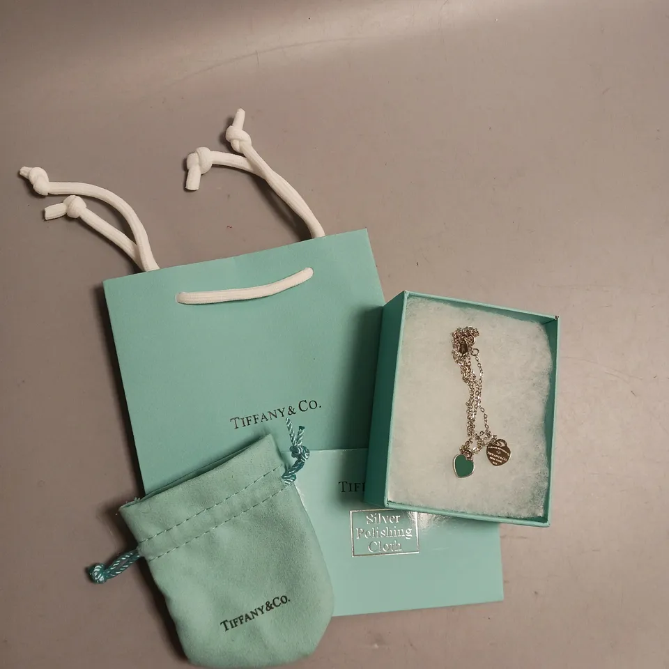 TIFFANY&CO NECKLACE IN SILVER AND TEAL HEART DESIGN INCLUDES BOX, POUCH, POLISHING CLOTH AND GIFT BAG