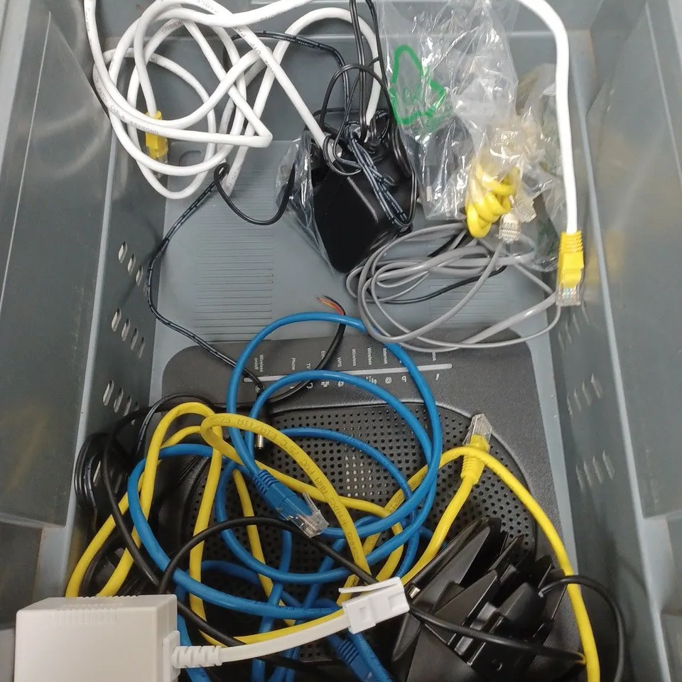 BOX OF APPROXIMATELY 10 ASSORTED ELECTRICXAL ITEMS TO INCLUDE ROUTERS , CABLES AND PLUGS
