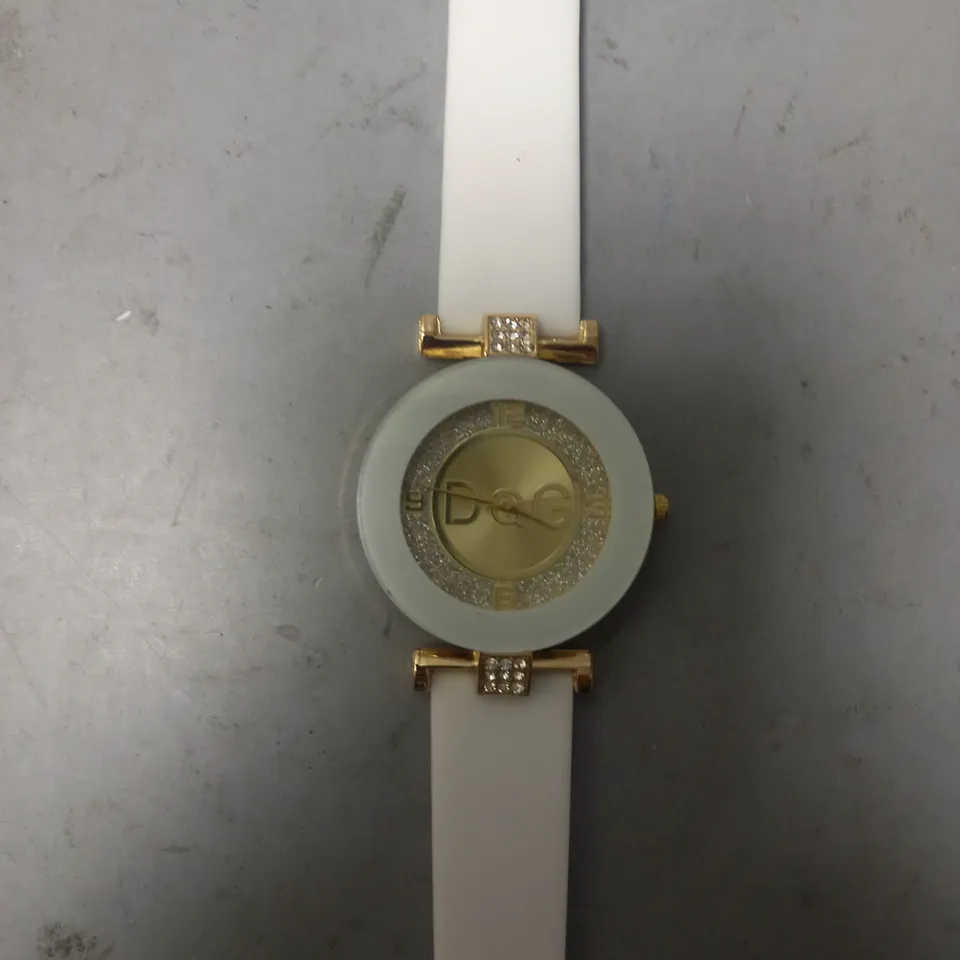 FOUR ASSORTED DQG WATCHES IN VARIOUS COLOURS W. DIAMANTE EFFECT