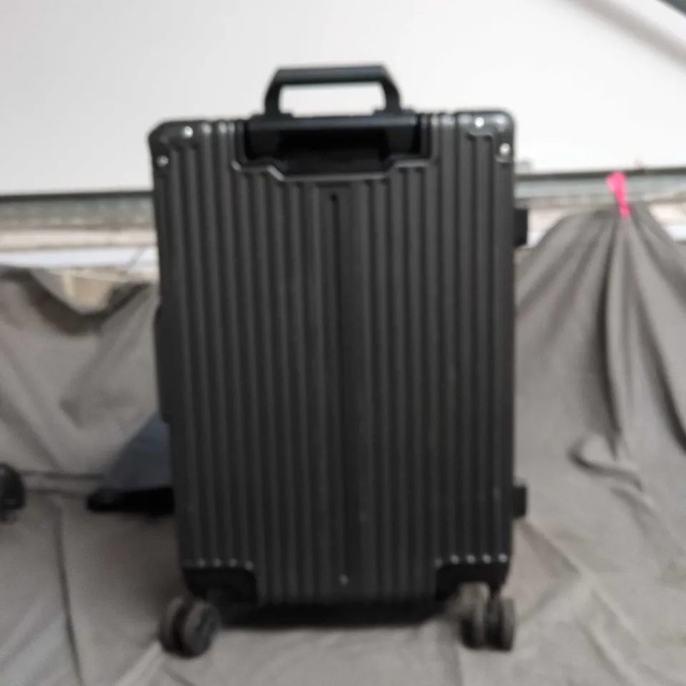 BLACK HARD-SHELL SUITCASE WITH FOUR WHEELS