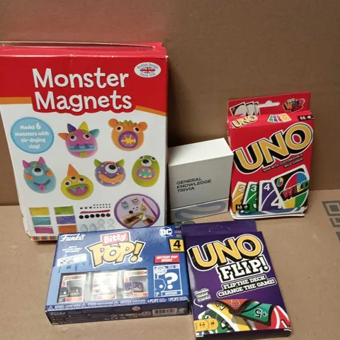 APPROXIMATELY 15 ASSORTED TOYS & GAMES PRODUCTS TO INCLUDE UNO CARD GAME, MONSTER MAGNETS, BITTY POP BATMAN, ETC