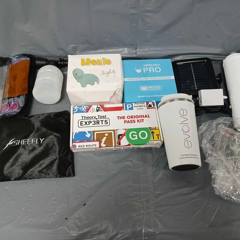 APPROXIMATELY 10 ASSORTED HOUSEHOLD ITEMS TO INCLUDE - CAMBRIDGE PRO MASK, BRONTO LIGHT, AND THEORY TEST PASS KIT ETC. 