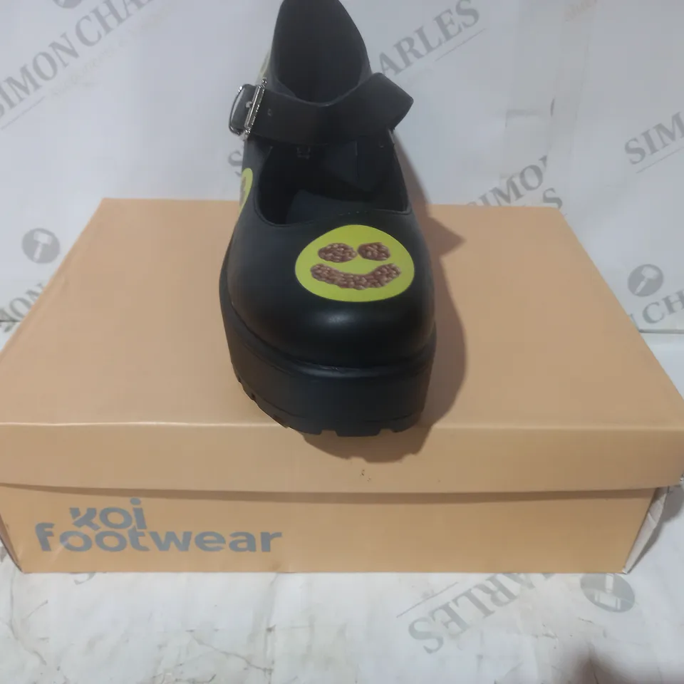 BRAND NEW BOXED PAIR OF KOI VEGAN LEATHER TIRA MARY JANES SPILL THE BEANS EDITION SHOES IN BLACK/BEAN SMILEY UK SIZE 4