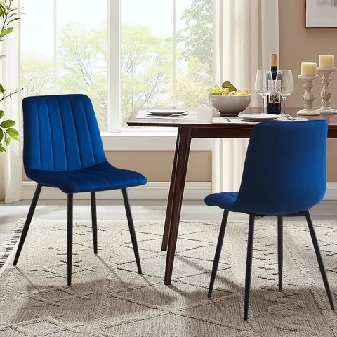A BOXED PAIR OF BLUE VELVET UPHOLSTERED DINING ROOM CHAIRS