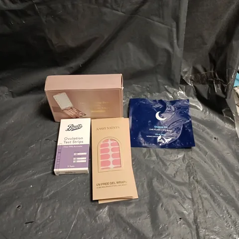 APPROXIMATELY 15 ASSORTED ITEMS OF COSMETICS INCLUDING BOOTS OVULATION TEST STRIPS, SNOOZE KIT EYE MASK AND PLUGS, UV FREE GEL WRAPS FOR NAILS AND TRAVEL MAKE UP SET
