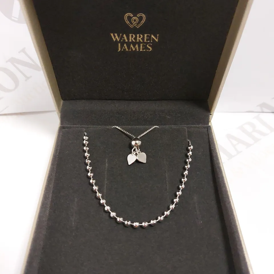 BOXED WARREN JAMES SILVER BRACELET WITH HEART DETAIL