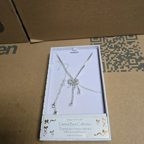 EQUILIBRIUM LONG LENGTH CHAIN ETERNAL BOW COLLECTION IN PRESENTATION BOX, PLATED WITH REAL SILVER.