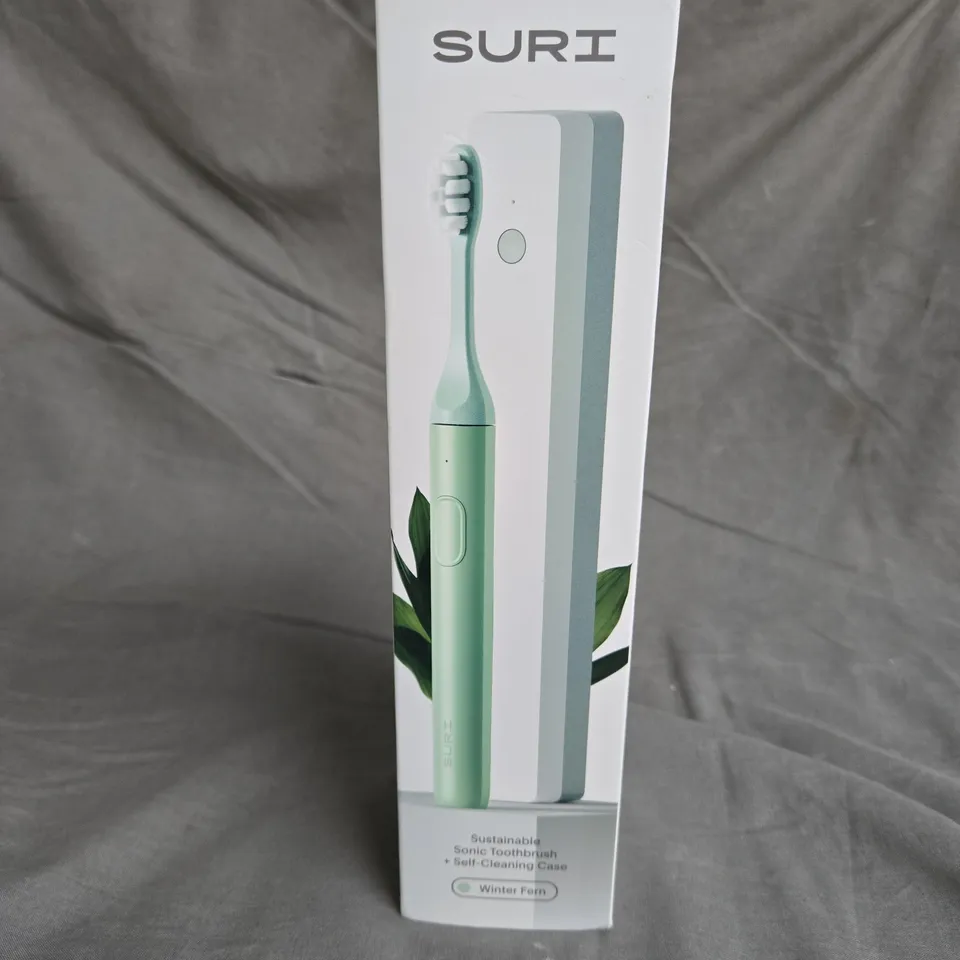 SEALED SURI SONIC TOOTHBRUSH IN WINTER FERM