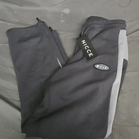 NICCE CONVEX INTERLOCK JOGGERS IN CIRCULAR GREY - MEDIUM