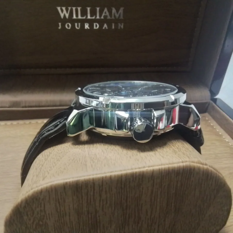 WILLIAM JOURDAIN STAINLESS STEEL GENTS CHRONOGRAPH WATCH WITH SKELETON BACK AND BLACK LEATHER STRAP IN WOODEN GIFT BOX