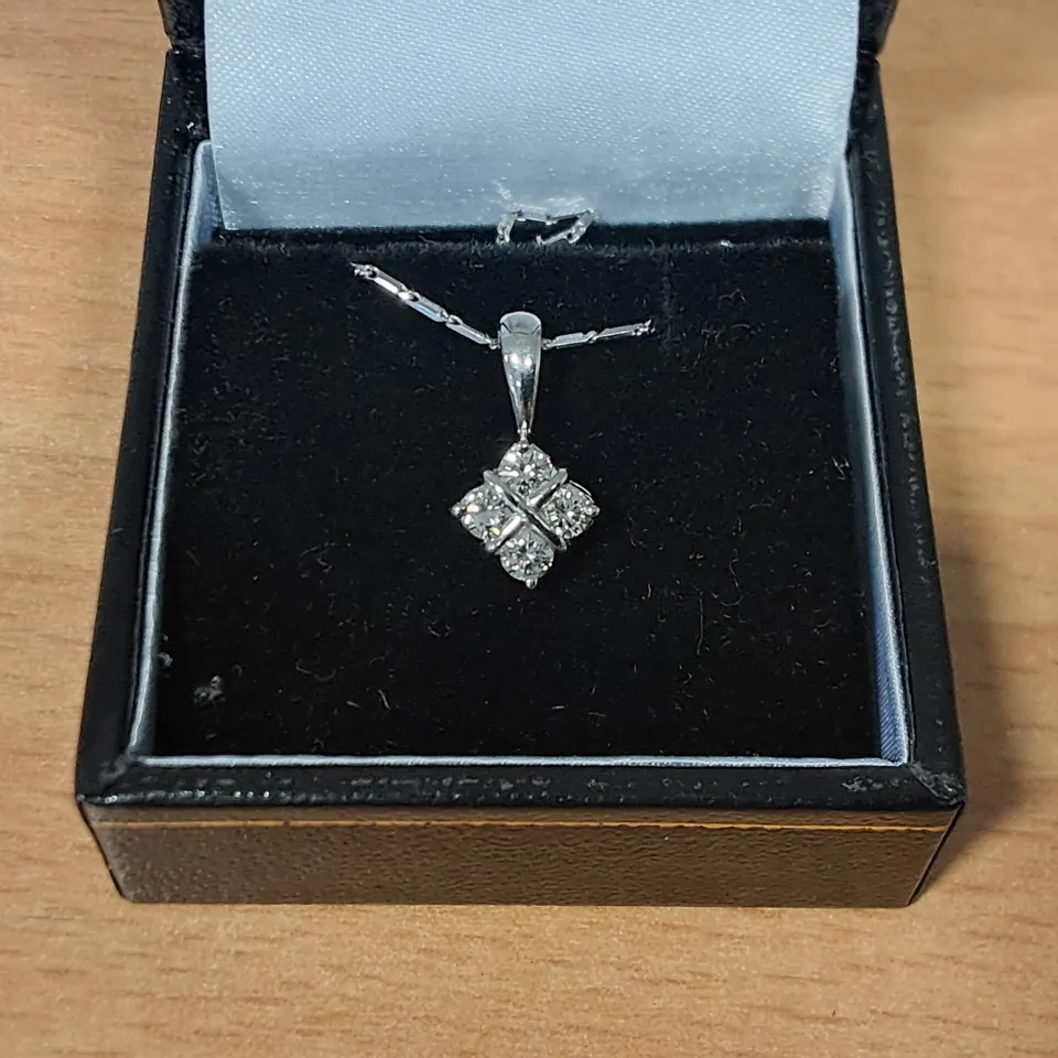 18CT WHITE GOLD SALTIRE PENDANT ON CHAIN SET WITH NATURAL DIAMONDS