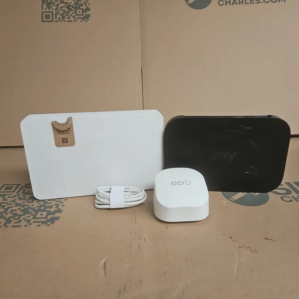 TOTE OF APPROXIMATELY 8 ASSORTED ITEMS TO INCLUDE SKY HUBS, EERO, CABLES ETC