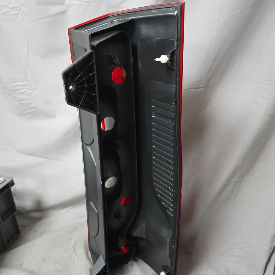 AUTOMOTIVE TAIL LIGHT ASSEMBLY – RED LENS WITH CLEAR INDICATOR - MODEL UNSPECIFIED