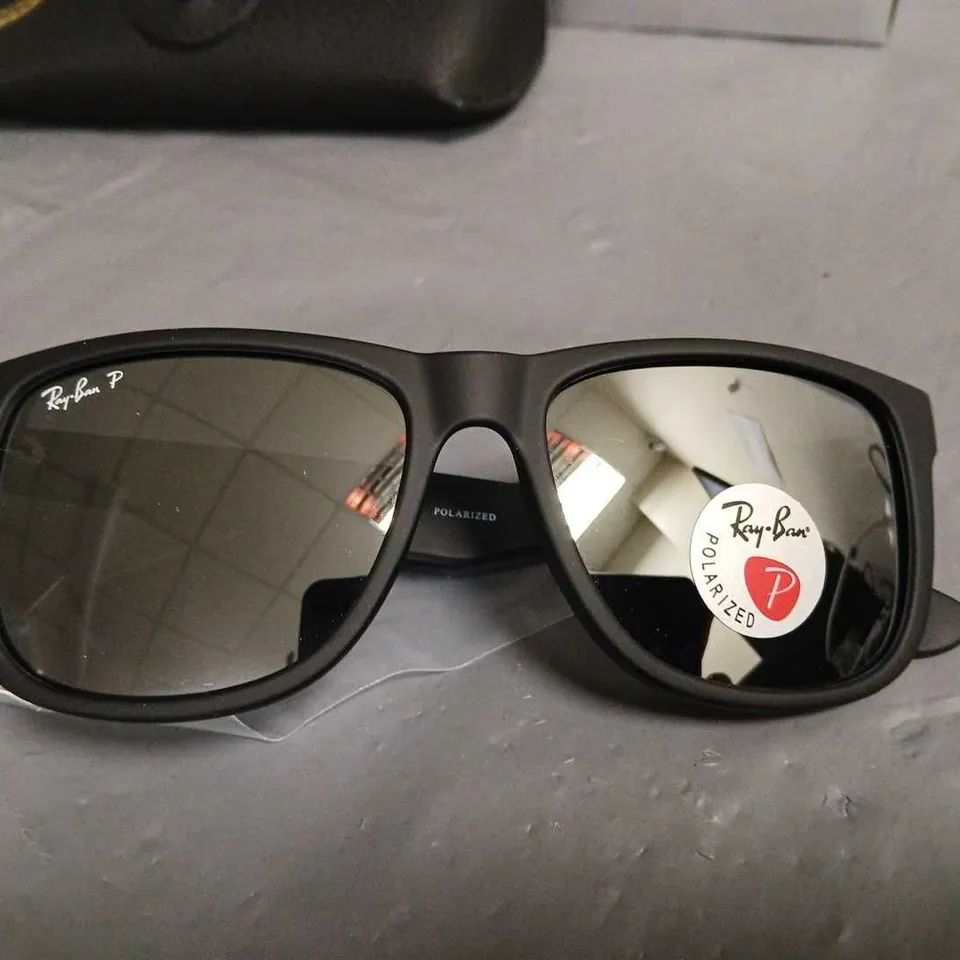 BOXED PAIR OF RAY BAN POLARISED BLACK FRAMED GLASSES