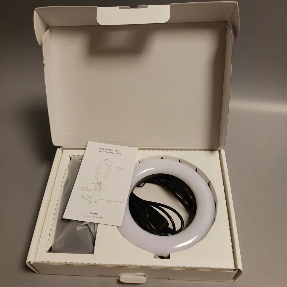 UNBRANDED 5 INCH RING LIGHT 3 LIGHT MODES, ADJUSTABLE BRIGHTNESS AND ADJUSTABLE SILICONE BASE STAND INCLUDED