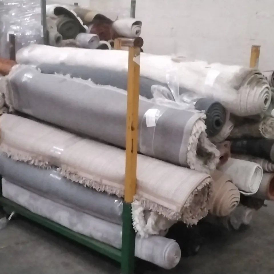 STILLAGE OF APPROXIMATELY 24 DESIGNER RUGS