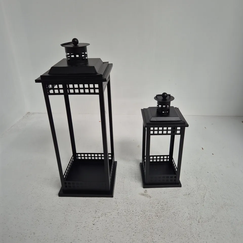 TWO BLACK METAL GARDEN LANTERNS WITH LATTICE PANELS - TALL AND SHORT