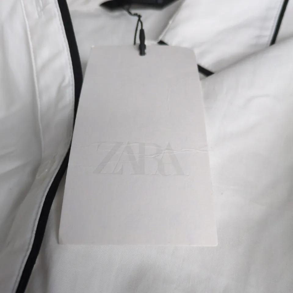 ZARA WHITE BLOUSE WITH NAVY PIPING – UK SIZE M