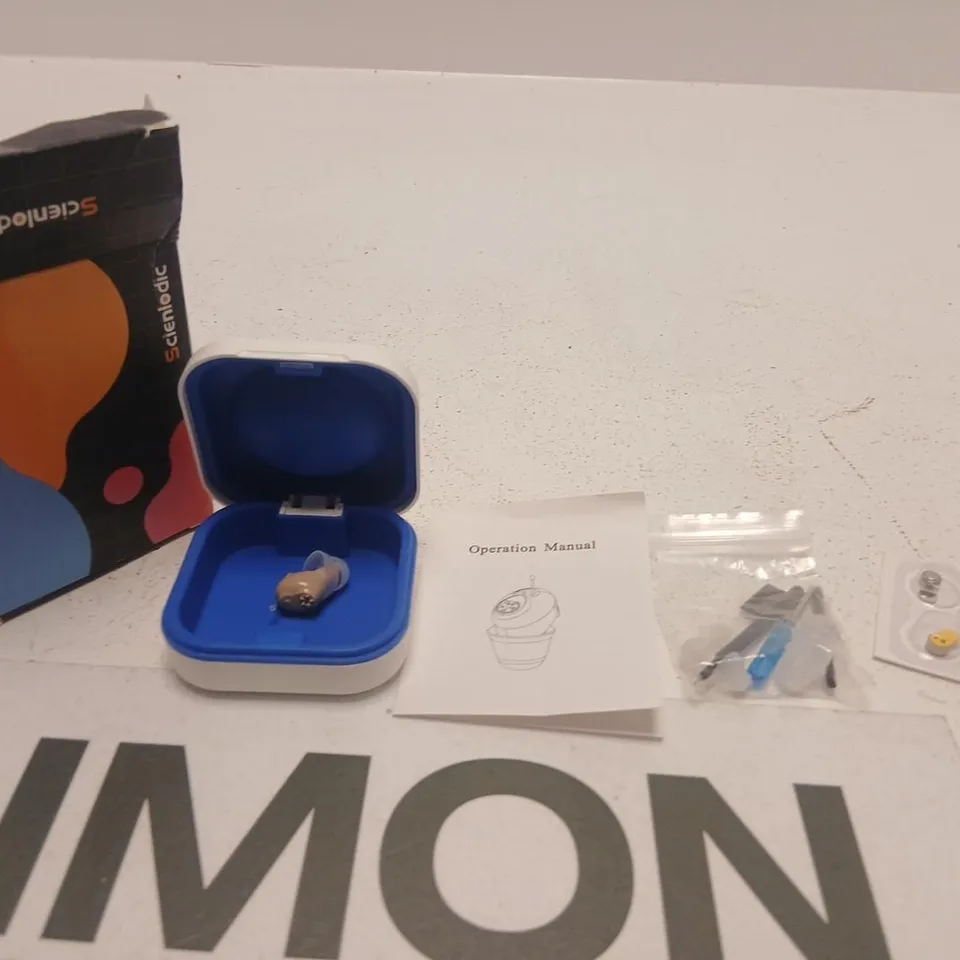 SCIENLODIC Hearing aid in blue case with manual 