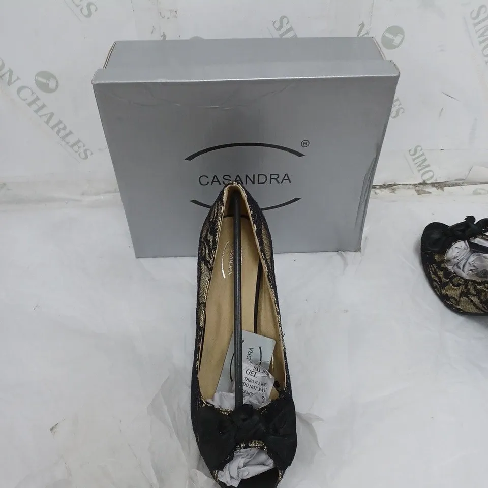 LARGE BOX OF BOXED APPROXIMATELY 10 CASSANDRA OPEN TOE HEELS IN BLACK/SAND IN VARIOUS SIZES