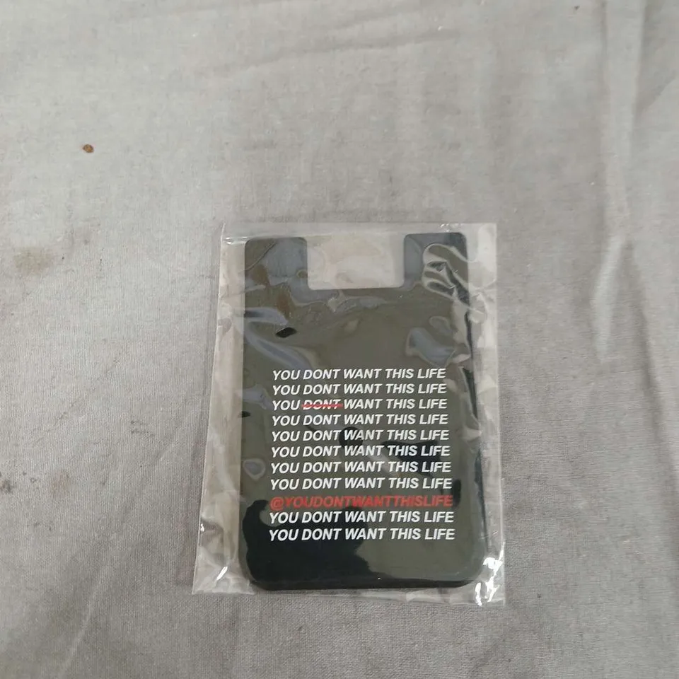 LARGE QUANTITY OF 3M ADHESIVE CARD HOLDERS FOR YOUR MOBILE PHONE WITH THE LOGO YOU DONT WANT THIS LIFE ON THE FRONT .