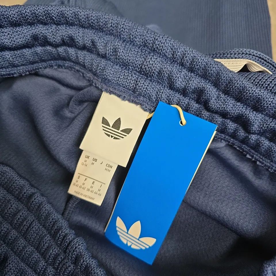 ADIDAS ORIGINALS BLUE TRACK PANTS WITH WHITE 3 STRIPES – UK MEDIUM (US MEDIUM)