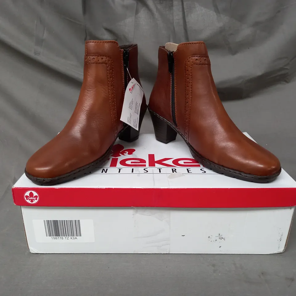 BOXED PAIR OF RIEKER BOOTS IN TAN SIZE 3.5