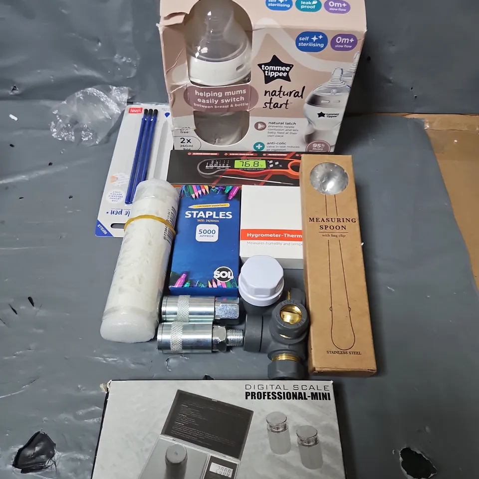 BOX OF ASSORTED HOUSEHOLD ITEMS TO INCLUDE TOMMEE TIPPEE, STAPLES AND MEASURING SPOON
