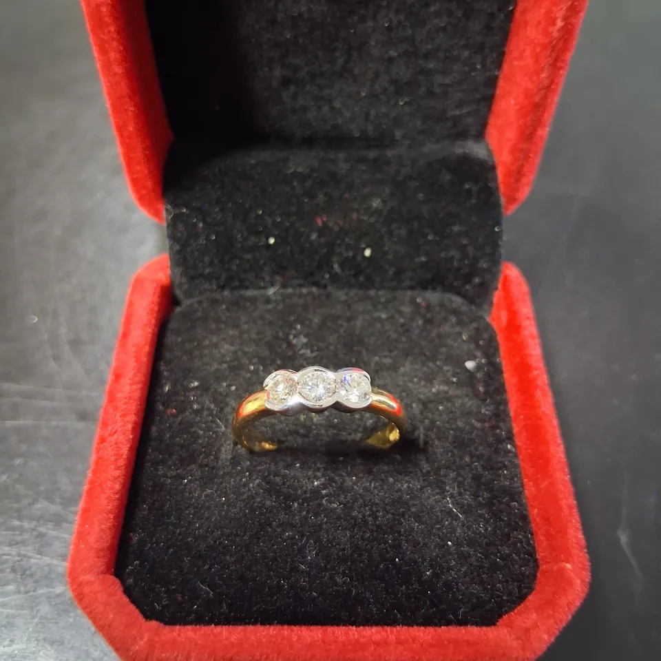 18CT GOLD THREE STONE RING RUB-OVER SET WITH NATURAL DIAMONDS 