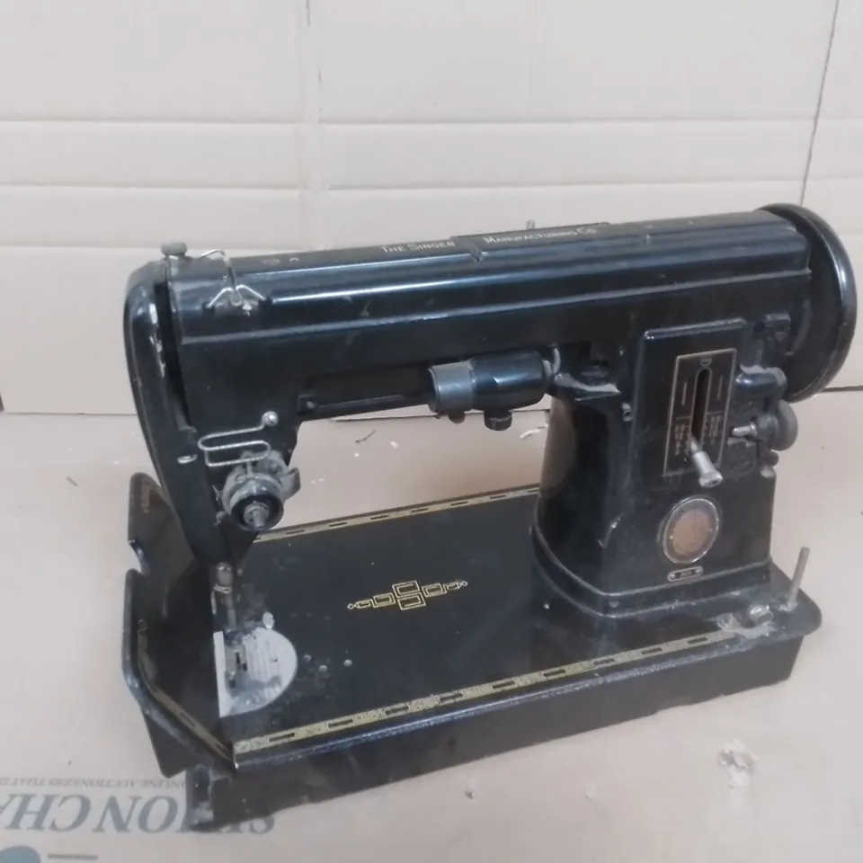 THE SINGER SEWING MACHINE