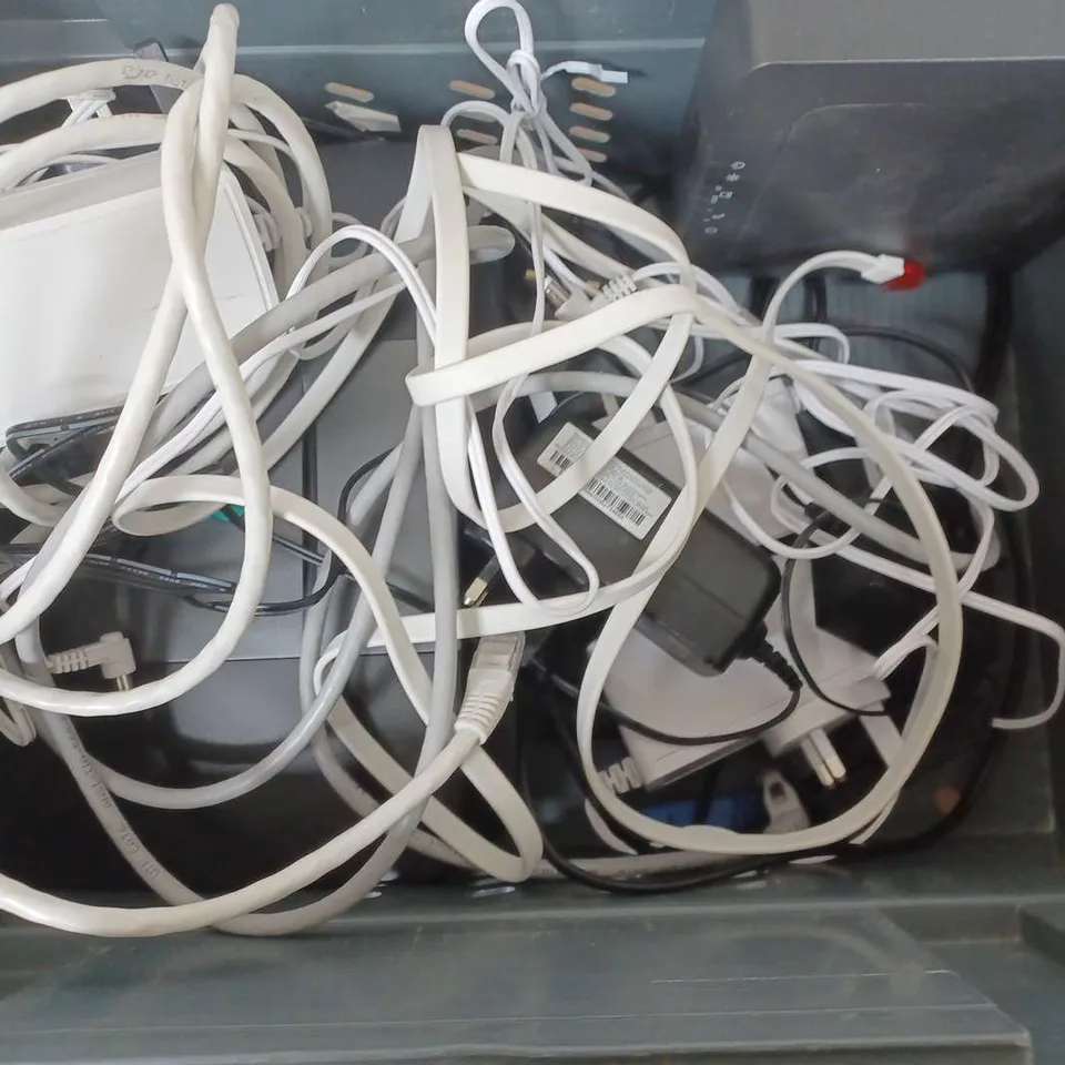 BOX OF ASSORTED CABLES AND LCOTERA INTERNET MODEMS 