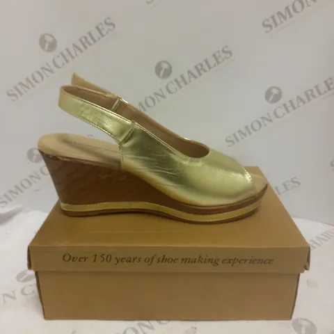 BOXED PAIR OF CUSHION WALK WEDGE SHOES IN GOLD - SIZE 6