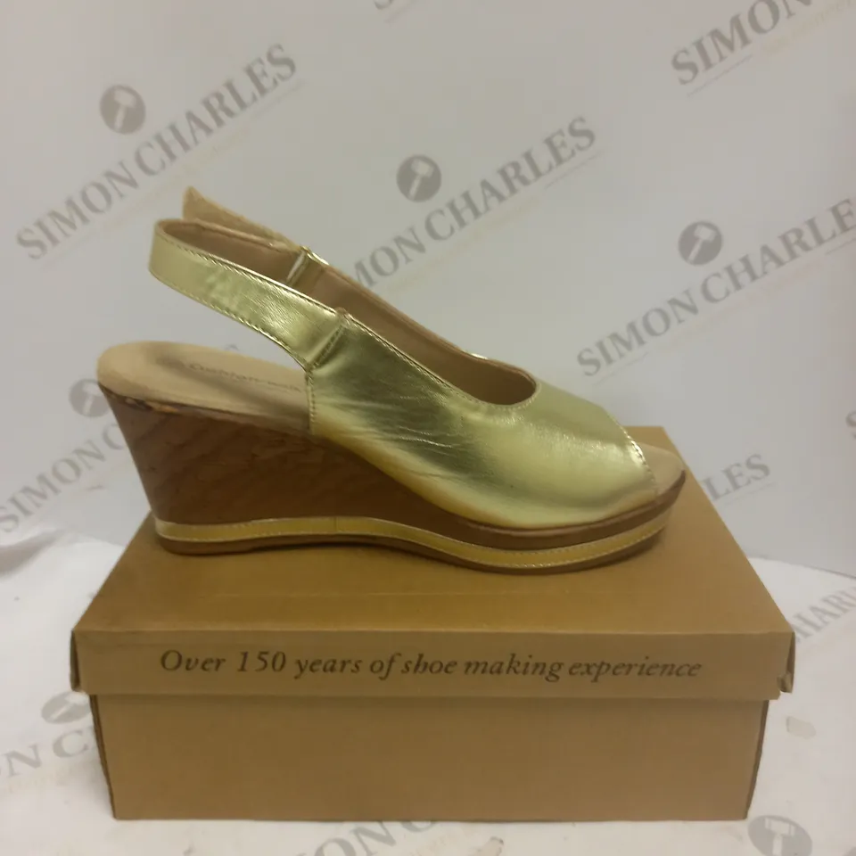 BOXED PAIR OF CUSHION WALK WEDGE SHOES IN GOLD - SIZE 6