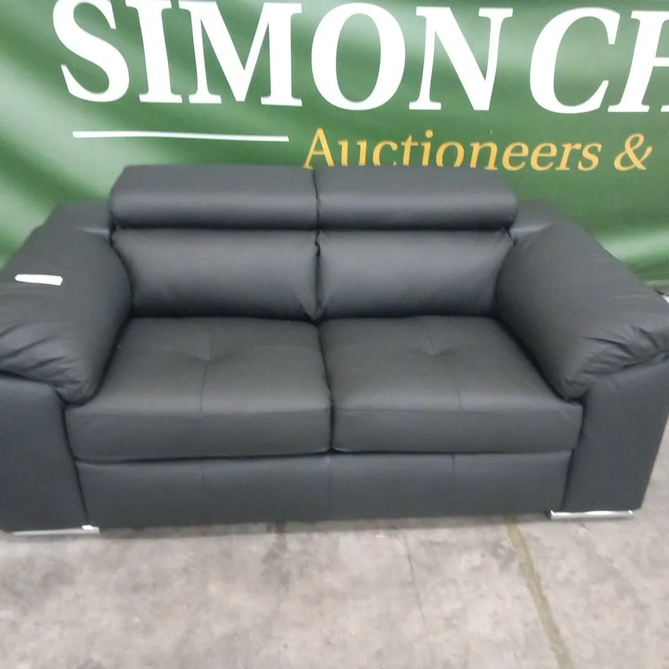 DESIGNER BLACK FAUX LEATHER TWO SEATER SOFA WITH SQUARE PANEL DETAIL AND ADJUSTABLE HEADRESTS