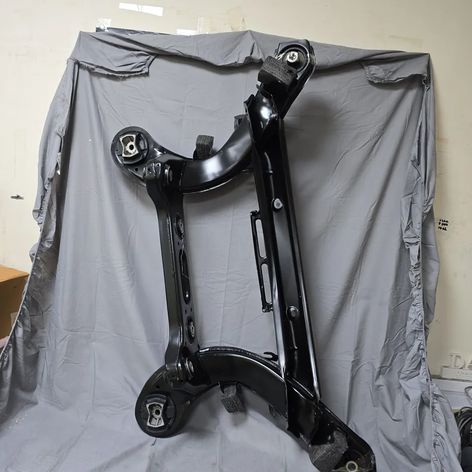 VEHICLE SUBFRAME (MODEL UNSPECIFIED) – BLACK-PAINTED METAL, MOUNTING POINTS VISIBLE