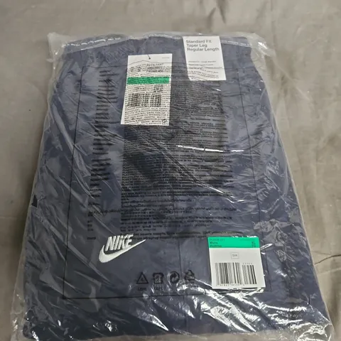 BAGGED NIKE NAVY TRACKSUIT BOTTOMS - XL