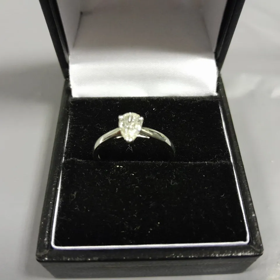 18CT GOLD SOLITAIRE RING SET WITH A NATURAL PEAR CUT DIAMOND WEIGHING