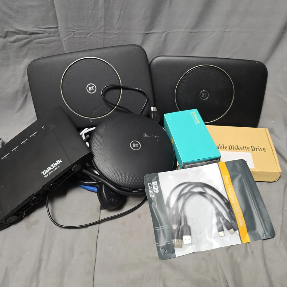 APPROXIMATELY 12 ASSORTED HOUSEHOLD ITEMS TO INCLUDE ROUTERS, FAST CHARGING USB CABLE, PORTABLE DISKETTE DRIVE, ETC