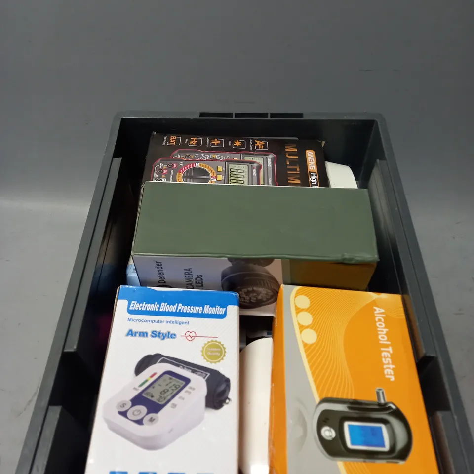 APPROXIMATELY 10 ASSORTED ELECTRICAL PRODUCTS TO INCLUDE DECOY CAMERA , ALCOHOL TESTS , PRESSURE MONITOR , ETC 