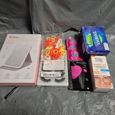 TOTE OF APPROXIMATELY 15 ASSORTED COSMETIC ITEMS TOO INCLUDE TAMPAX , CONDOMS AND EYE LASHES