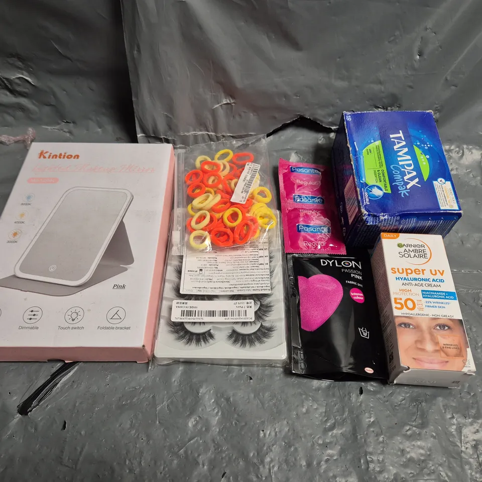 TOTE OF APPROXIMATELY 15 ASSORTED COSMETIC ITEMS TOO INCLUDE TAMPAX , CONDOMS AND EYE LASHES