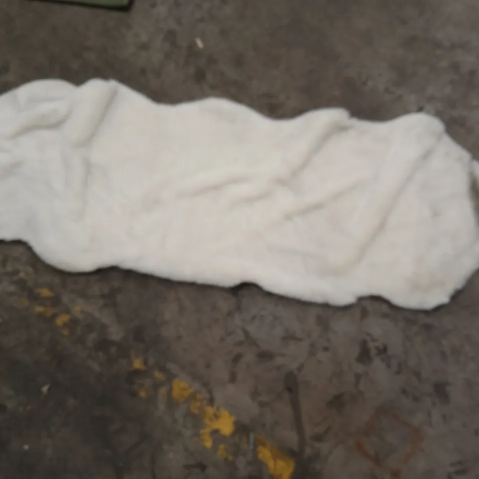 STILLAGE OF APPROXIMATELY 25 DESIGNER RUGS