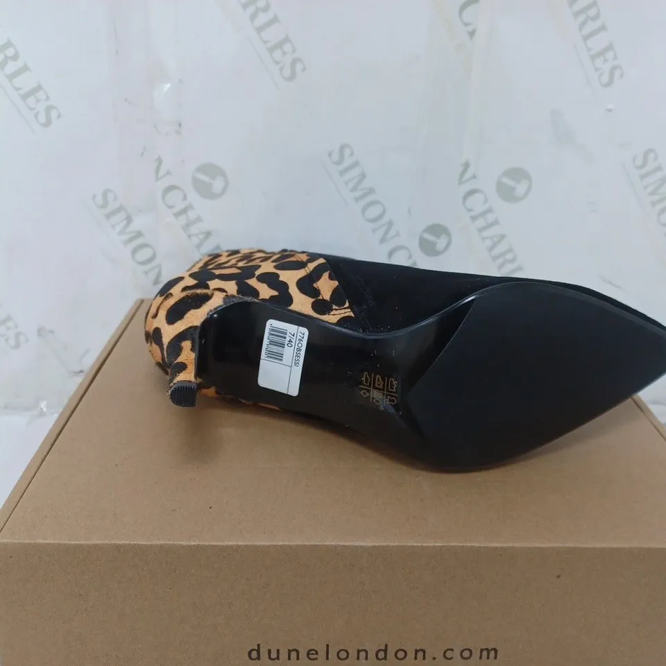 BOXED PAIR OF DUNE HEELED BOOTS IN LEOPARD SIZE 7 