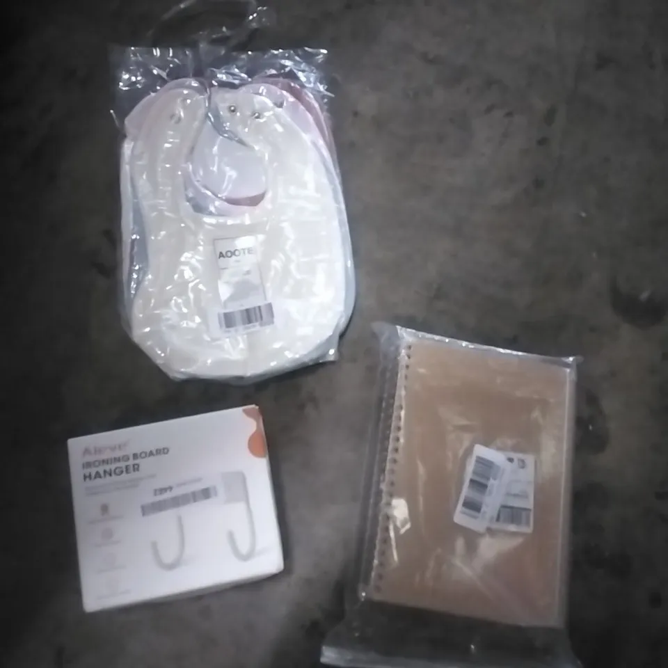 PALLET OF ASSORTED ITEMS TO INCLUDE; BABY BIBS, IRONING BOARD HANGER, NOTE BOOKS 