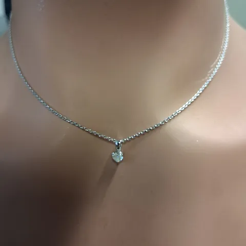 WHITE GOLD PENDANT ON CHAIN, SET WITH A NATURAL HEART SHAPE DIAMOND