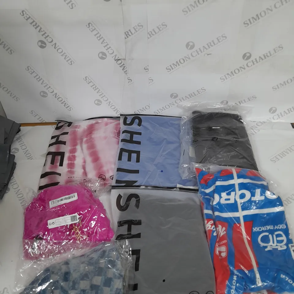 LARGE BOX OF ASSORTED CLOTHING ITEMS IN VARIOUS COLOURS AND SIZES INCLUDING TROUSERS , TOPS AND JUMPERS 